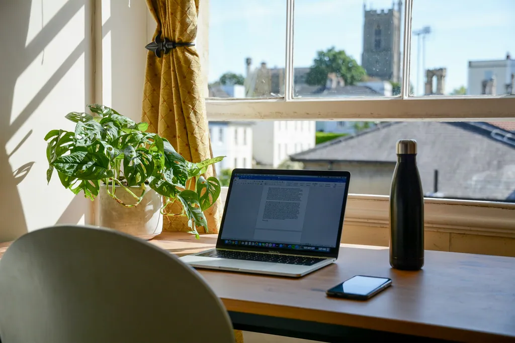 A home office by a window in daylight